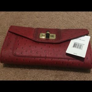 New-Never used blood ox red faux ostrich clutch